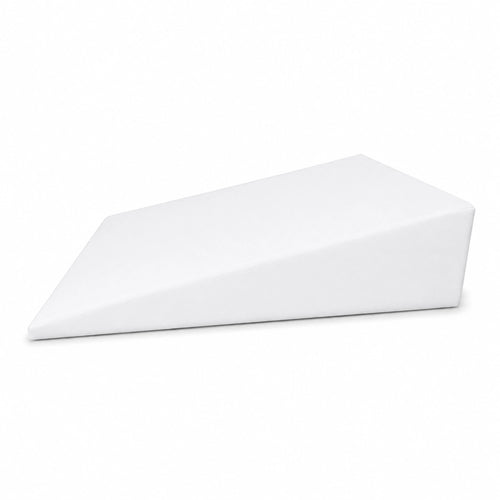 Bed wedge with white cover positioned on a bed, showing its gradual slope