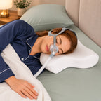 Travel CPAP pillow in use in a bedroom with a nasal mask